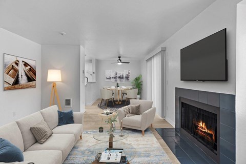 a living room with a fireplace and a couch